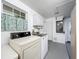 Functional laundry room, including washer and dryer at 1559 Lakeshore Dr, Eustis, FL 32726