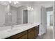 Double vanity bathroom with wood cabinets and quartz countertop at 3018 Mirage Pl, St Cloud, FL 34771