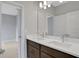 Double vanity bathroom with dark brown cabinets at 3018 Mirage Pl, St Cloud, FL 34771