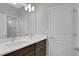 Double vanity bathroom with dark brown cabinets at 3018 Mirage Pl, St Cloud, FL 34771