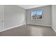 Simple bedroom with grey walls and wood-look tile flooring at 3018 Mirage Pl, St Cloud, FL 34771