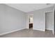 Bedroom with grey walls, tile flooring, and en-suite bathroom at 3018 Mirage Pl, St Cloud, FL 34771