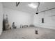 Unfinished garage interior with concrete floor and storage at 3018 Mirage Pl, St Cloud, FL 34771