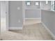 Upstairs hallway with neutral walls and carpet at 3018 Mirage Pl, St Cloud, FL 34771