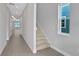 Bright hallway with tile floors and staircase at 3018 Mirage Pl, St Cloud, FL 34771