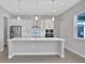 Modern kitchen with stainless steel appliances and white cabinets at 3018 Mirage Pl, St Cloud, FL 34771