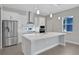 Modern kitchen with island and stainless steel appliances at 3018 Mirage Pl, St Cloud, FL 34771