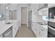Modern kitchen with stainless steel appliances and white cabinets at 3018 Mirage Pl, St Cloud, FL 34771