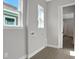 Laundry room with two windows, tile flooring, and hookups at 3018 Mirage Pl, St Cloud, FL 34771