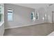 Spacious living room with grey walls and tile flooring at 3018 Mirage Pl, St Cloud, FL 34771