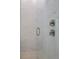 Walk-in shower with marble tile and modern fixtures at 3018 Mirage Pl, St Cloud, FL 34771