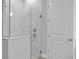 Modern shower with frameless glass enclosure and marble tile at 3018 Mirage Pl, St Cloud, FL 34771