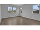 Spacious bedroom with wood-look tile flooring and large windows at 3108 Expedition Dr, Saint Cloud, FL 34771