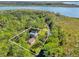 Aerial view of house and lot near the water at 7373 Circle Dr, Lady Lake, FL 32159