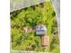 Aerial view of property highlighting house, detached garage and large lot at 7373 Circle Dr, Lady Lake, FL 32159