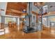 Spacious living area with a wood-burning stove and open loft at 7373 Circle Dr, Lady Lake, FL 32159