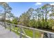 Deck with tranquil water and treetop views at 7373 Circle Dr, Lady Lake, FL 32159