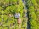 Aerial view of property showcasing house, detached garage, and waterfront access at 7373 Circle Dr, Lady Lake, FL 32159