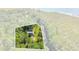 Aerial view of a home on a wooded lot, near the water at 7373 Circle Dr, Lady Lake, FL 32159