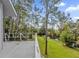 Deck overlooks a peaceful backyard with water view at 7373 Circle Dr, Lady Lake, FL 32159