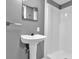 Basement bathroom with pedestal sink and shower at 7373 Circle Dr, Lady Lake, FL 32159