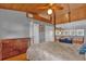 Spacious bedroom with a loft and wood floors at 7373 Circle Dr, Lady Lake, FL 32159