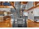 Open concept living area with a wood-burning stove and loft at 7373 Circle Dr, Lady Lake, FL 32159