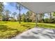 Covered patio overlooking a large backyard at 7373 Circle Dr, Lady Lake, FL 32159