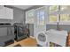 Laundry room with washer, dryer, and utility sink at 7373 Circle Dr, Lady Lake, FL 32159