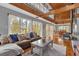 Open living space with vaulted ceilings and a cozy sectional sofa at 7373 Circle Dr, Lady Lake, FL 32159