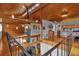 Open loft area with a spiral staircase and wood beams at 7373 Circle Dr, Lady Lake, FL 32159