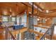Open loft area overlooks the main living space with wood ceilings and floors at 7373 Circle Dr, Lady Lake, FL 32159