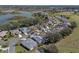 Aerial view of home and neighborhood, highlighting proximity to a golf course at 4848 Saint Andrews Arc, Leesburg, FL 34748