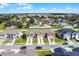 Aerial view of townhouses with community and surrounding area at 1496 Mirabella Cir, Davenport, FL 33897