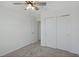 Spacious bedroom with neutral walls, carpet, and ceiling fan at 1496 Mirabella Cir, Davenport, FL 33897