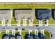 Drone shot of town houses from above, showing layout and parking at 1496 Mirabella Cir, Davenport, FL 33897