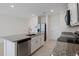 Kitchen island with granite countertop, stainless steel sink and dishwasher at 1496 Mirabella Cir, Davenport, FL 33897