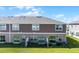Aerial view of home showcasing rear elevation and backyard at 1496 Mirabella Cir, Davenport, FL 33897