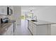 Modern kitchen with stainless steel appliances and granite countertops at 1496 Mirabella Cir, Davenport, FL 33897
