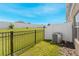 Private backyard with fenced area and AC unit at 1496 Mirabella Cir, Davenport, FL 33897