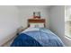 Well-lit bedroom featuring a double bed and nightstand at 656 Daring Dr, Davenport, FL 33837