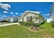 Single-story house with a landscaped front yard and attached garage at 656 Daring Dr, Davenport, FL 33837