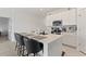 Modern kitchen with stainless steel appliances and an island with seating at 656 Daring Dr, Davenport, FL 33837
