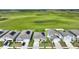 Aerial view of houses with solar panels in a residential community at 656 Daring Dr, Davenport, FL 33837