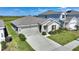 Single-story home with solar panels and landscaped yard at 656 Daring Dr, Davenport, FL 33837