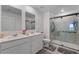 Bathroom with double vanity and walk-in shower at 656 Daring Dr, Davenport, FL 33837