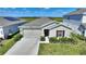 Single-story home with solar panels and landscaped yard at 656 Daring Dr, Davenport, FL 33837