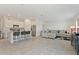 Open concept kitchen with island and stainless steel appliances at 656 Daring Dr, Davenport, FL 33837