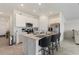 Modern kitchen with stainless steel appliances and an island with seating at 656 Daring Dr, Davenport, FL 33837