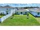 Spacious backyard with a grassy lawn and privacy fence at 656 Daring Dr, Davenport, FL 33837